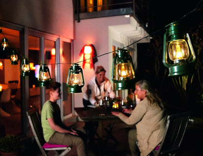 Konstsmide LED Beer Garden Party Light Lantern Chain, Outdoor Lights Flickering Flame Effect/Outdoor (IP44) / 8 Green Lanterns / 8 Flickering Diodes/Transparent Cable String Lights
